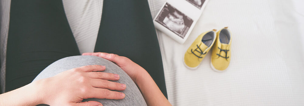 Young pregnant woman relaxing on sofa